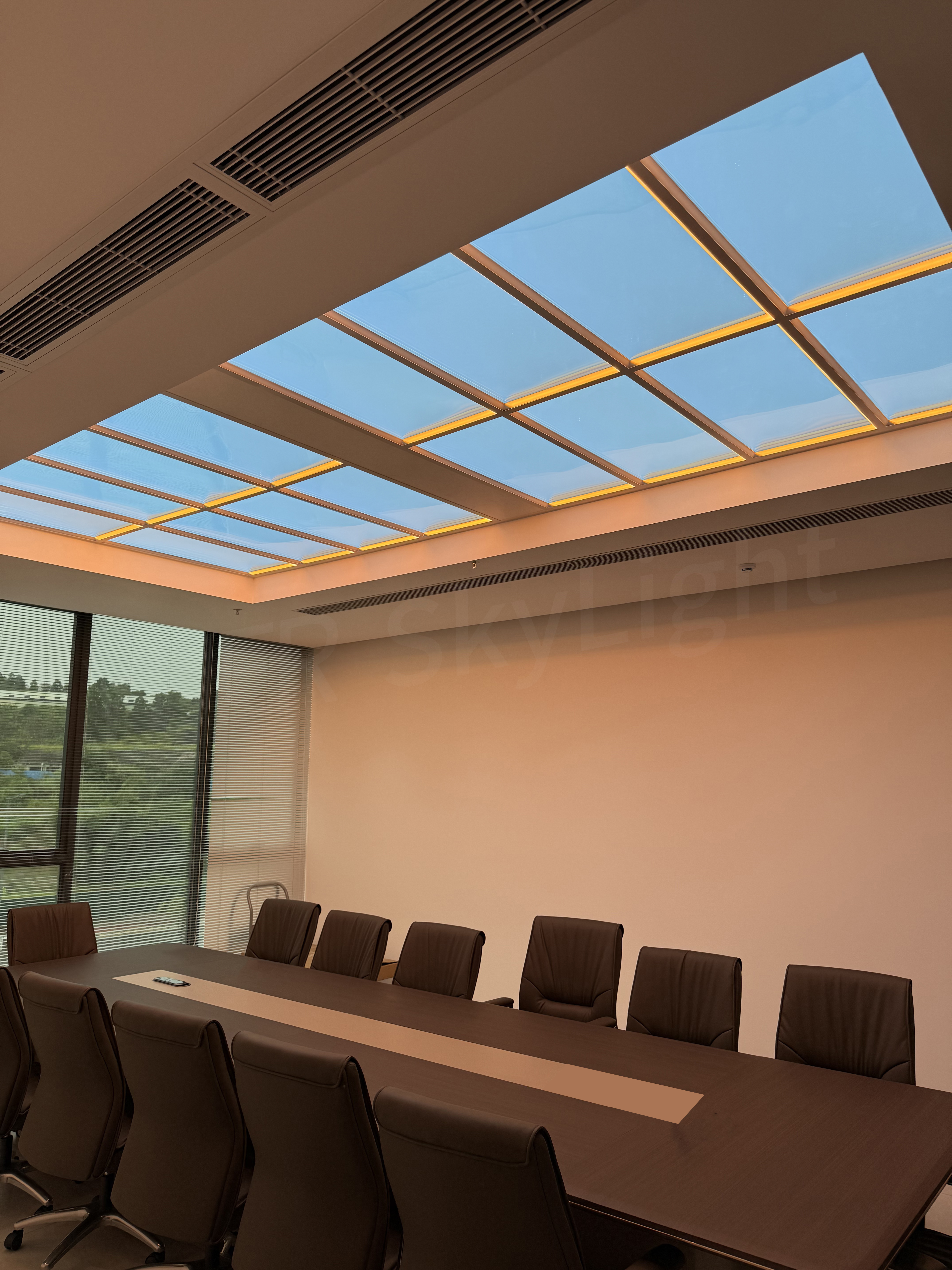 A deep-plan commercial office lit as though by natural daylight